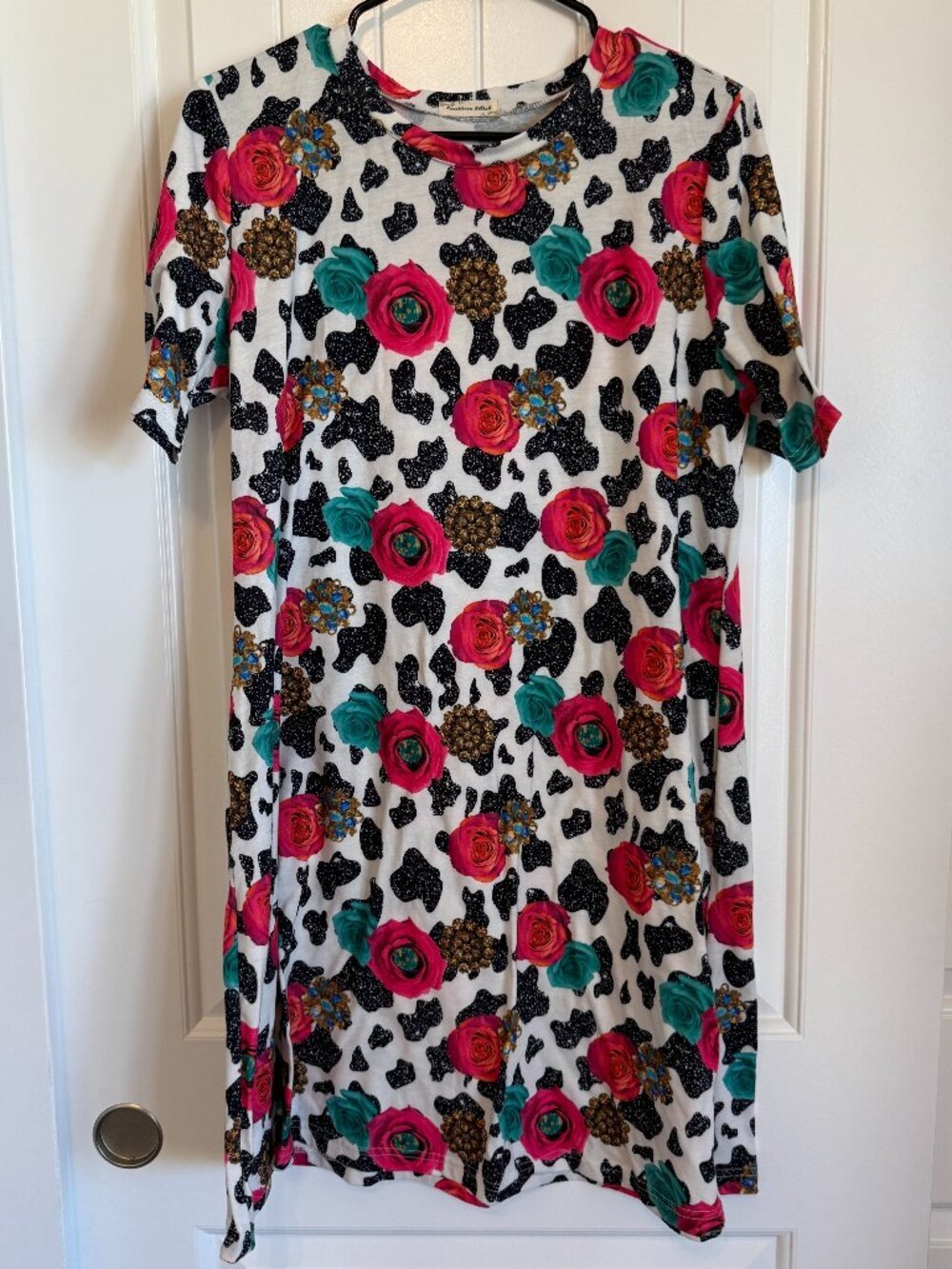 Southern Stitch short sleeve t-shirt dress with floral and cow print design.